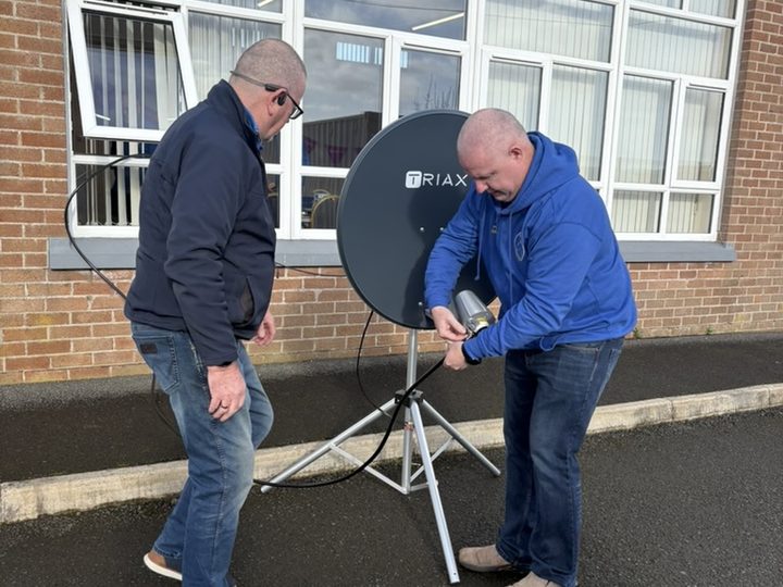 Final adjustments to the outdoor satellite station.